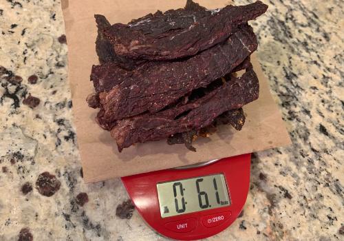 Finished jerky on a scale reading 6.1 ounces