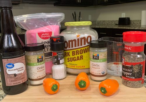 Habaneros, brown sugar, Worcestershire sauce, and seasonings on a cutting board