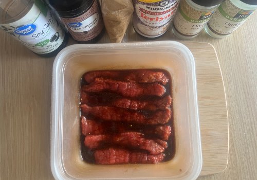 Long beef strips coated in red-brown marinade