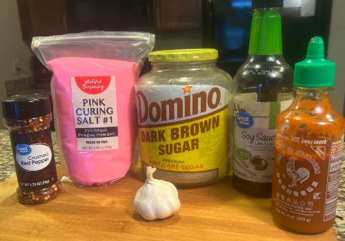 Sriracha, soy sauce, garlic, brown sugar, red pepper, and curing salt