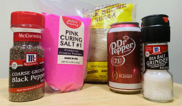 Dr Pepper with black pepper, salt, curing salt, and a seasoning packet