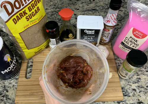 Beef coated in marinade with the ingredients arranged around it