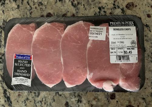 A tray of packaged boneless pork chops