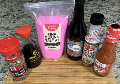 Hot sauce, soy sauce, liquid smoke, pepper, and curing salt