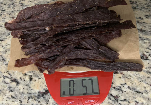 Finished jerky on a scale reading 5.7 ounces