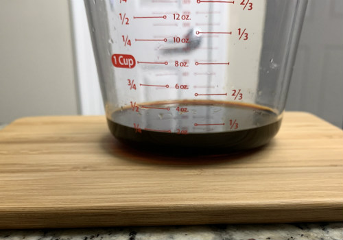 Dark sauce in a clear measuring cup