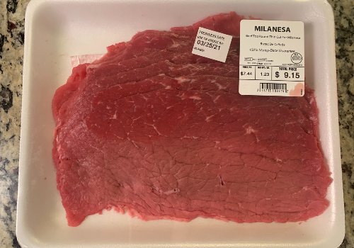Packaged thin-cut beef labeled Milanesa