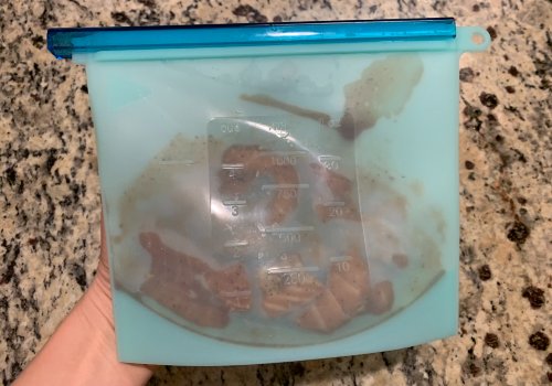 Marinated salmon in a reusable bag with a blue closure