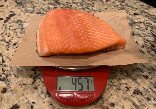 Salmon fillet on a digital scale with the gram setting
