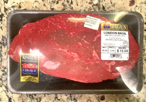 Packaged top round London broil on a counter