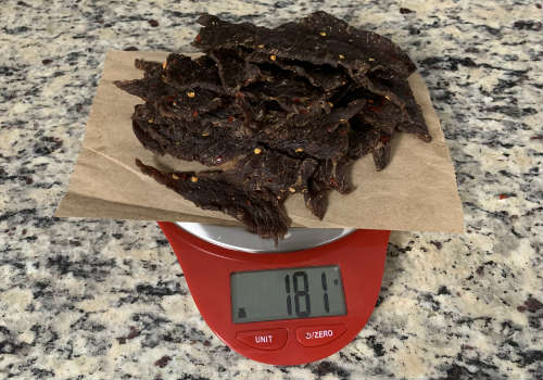 Finished jerky on a scale reading 181 grams