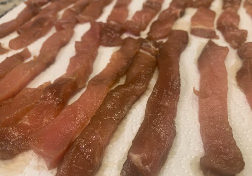 Marinated pork strips laid on paper towels