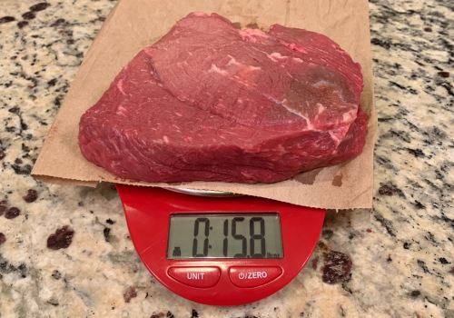 Raw beef on a digital scale set to ounces