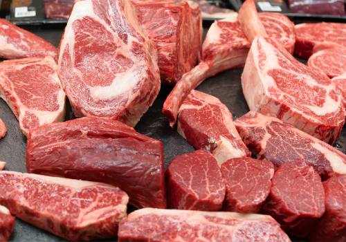 Assorted heavily marbled steaks displayed together